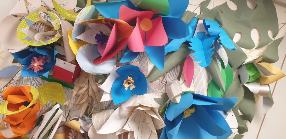 Paper flowers forming a wall mural